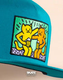 GORRA PLANA PRAYERS HARING AZUL AMARILLO NARANJA