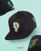 GORRA PLANA PRAYERS GENIUS NEGRO BLANCO